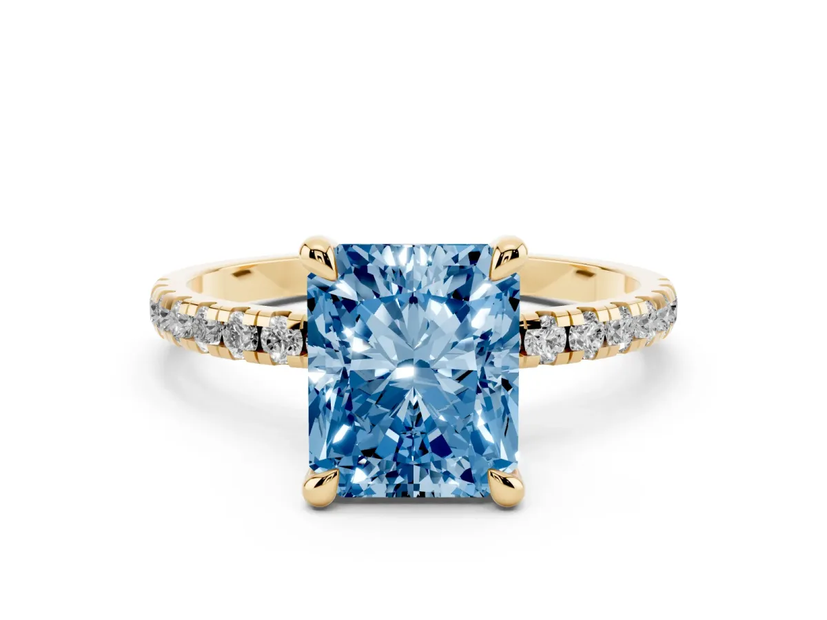 Fancy Blue Radiant Cut Diamond Brilliant Solitaire Ring with Pavé Band and Four-Prong Setting Yellow gold