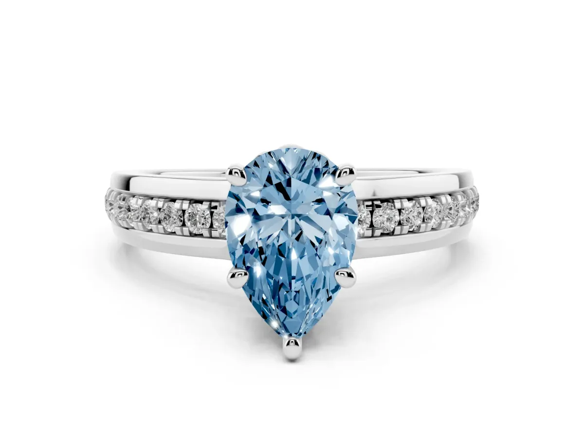 Fancy Blue Pear Cut Solitaire Diamond Ring with Channel Set Band and Six-Prong Setting Silver