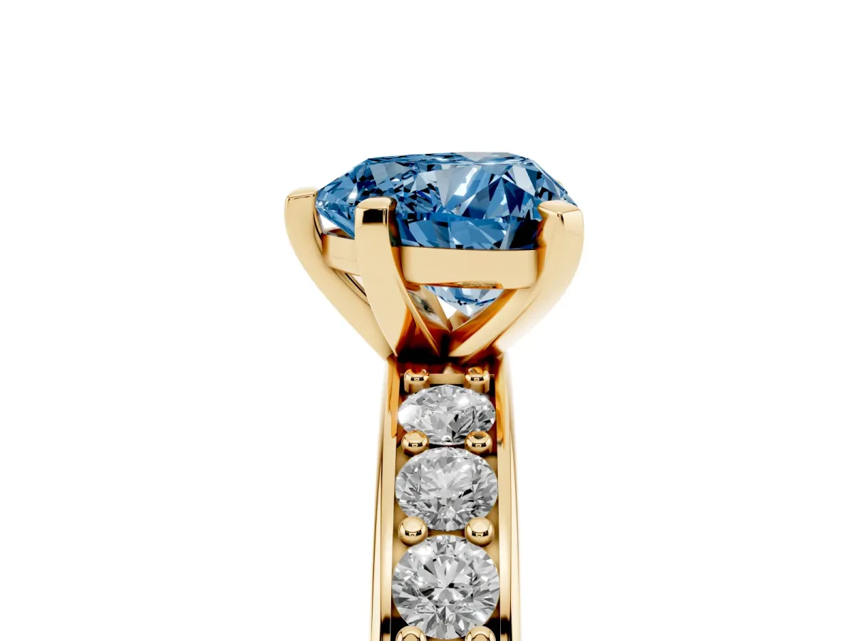 Fancy Blue Heart Cut Diamond Engagement Ring with Channel Set Round Band and Prong Setting Yellow gold