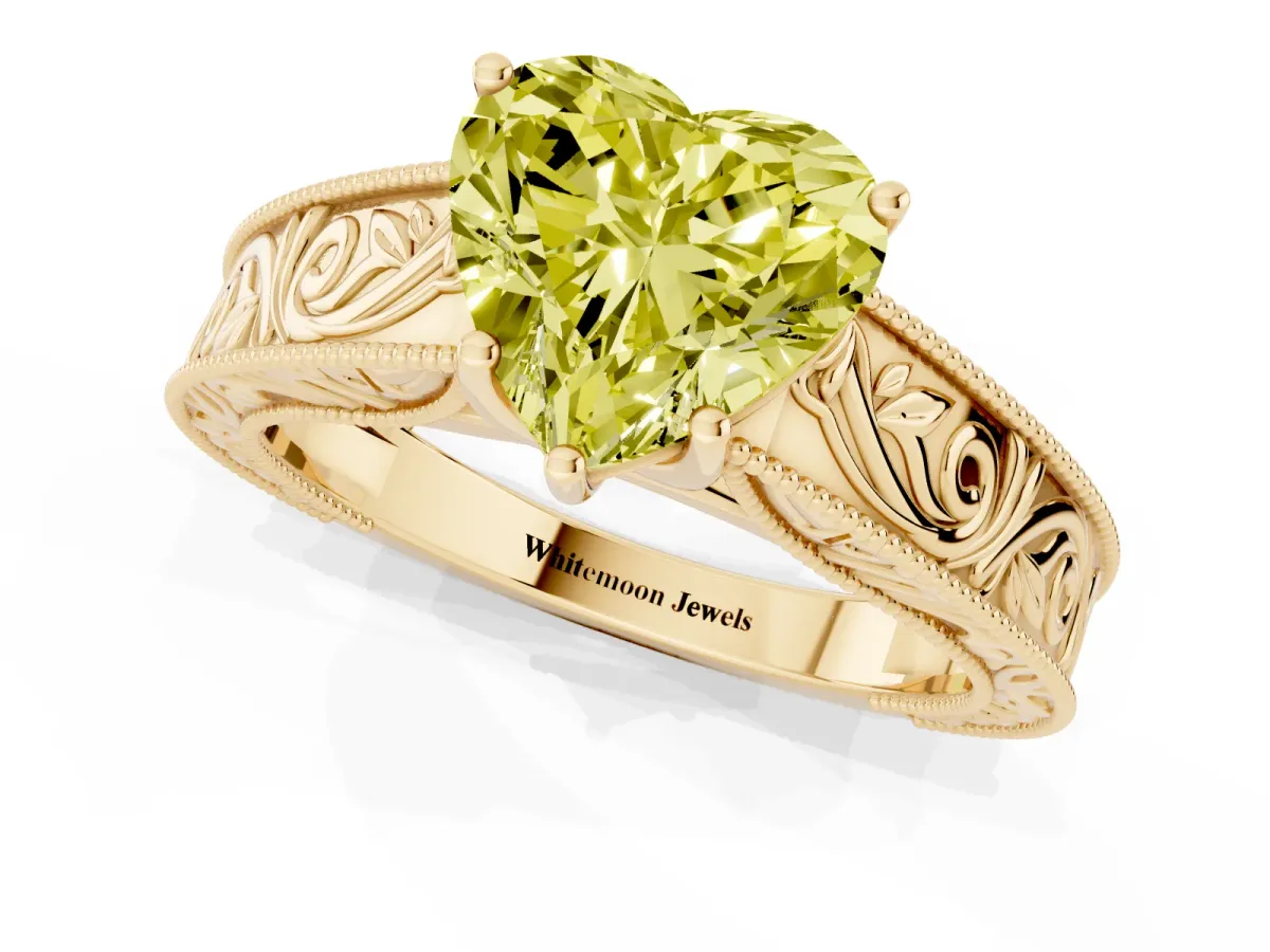 Fancy Yellow Heart Cut Diamond Solitaire Ring with Engraved Band and Four-Prong Setting Yellow gold