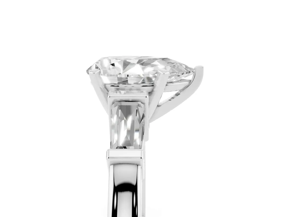 Pear Cut Cut Diamond Solitaire Ring with Tapered Baguette Accents and Four-Prong Setting White gold
