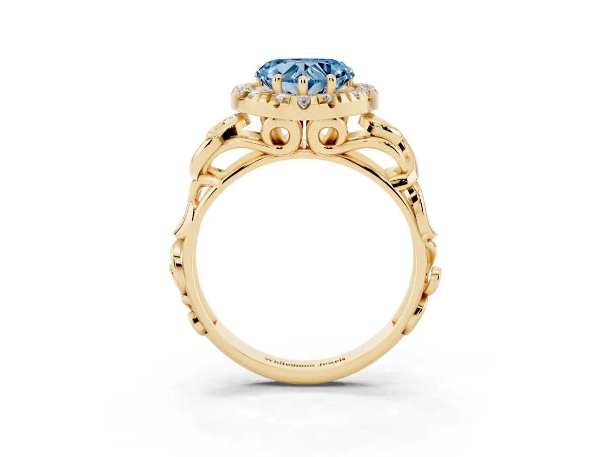 Fancy Blue Heart Cut Cut Halo Diamond Ring with Scrollwork Band and Four-Prong Setting Yellow gold