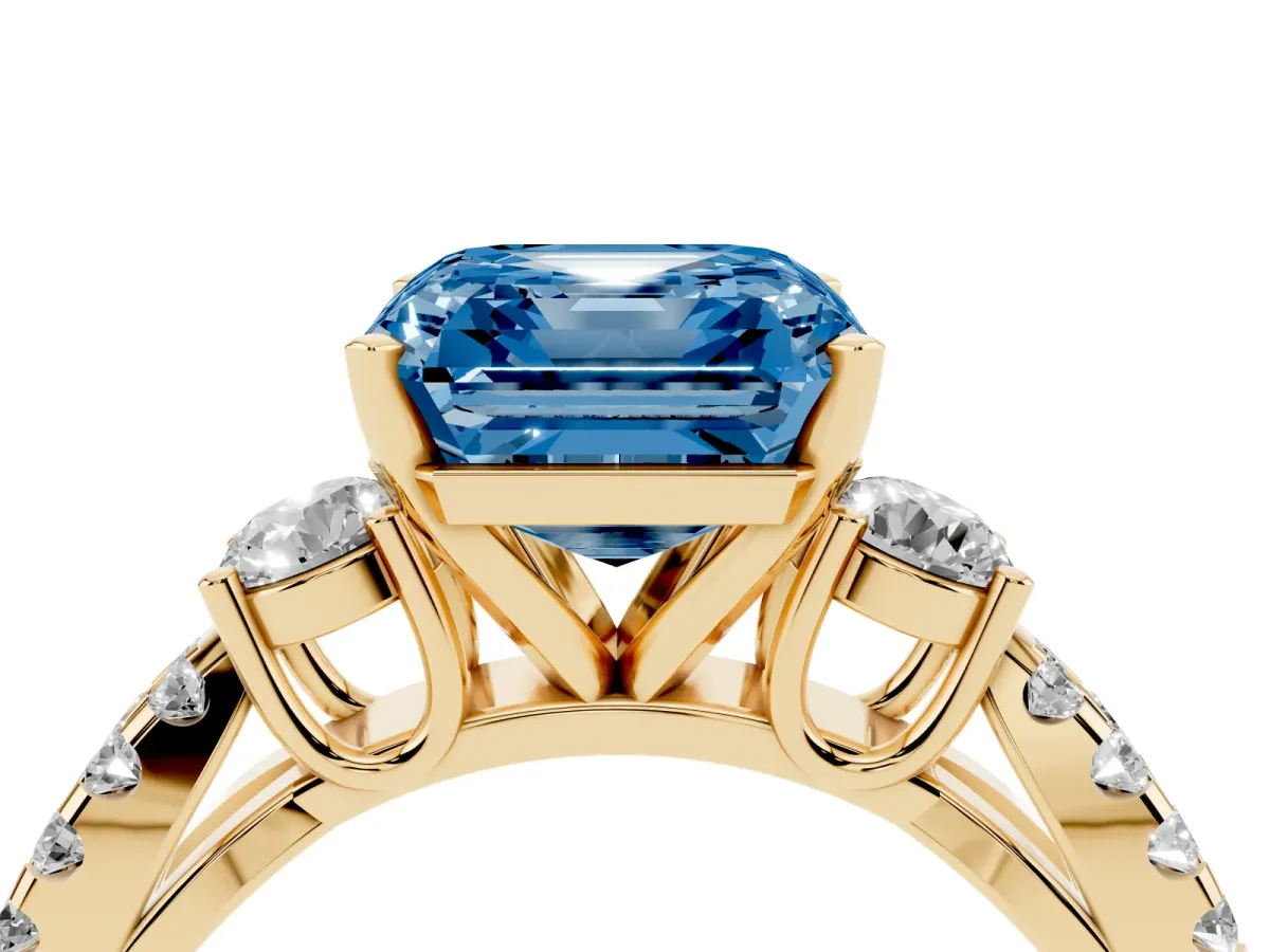 Fancy Blue Asscher Cut Diamond Three-Stone Ring with Pavé Split Shank and Four-Prong Setting Yellow gold