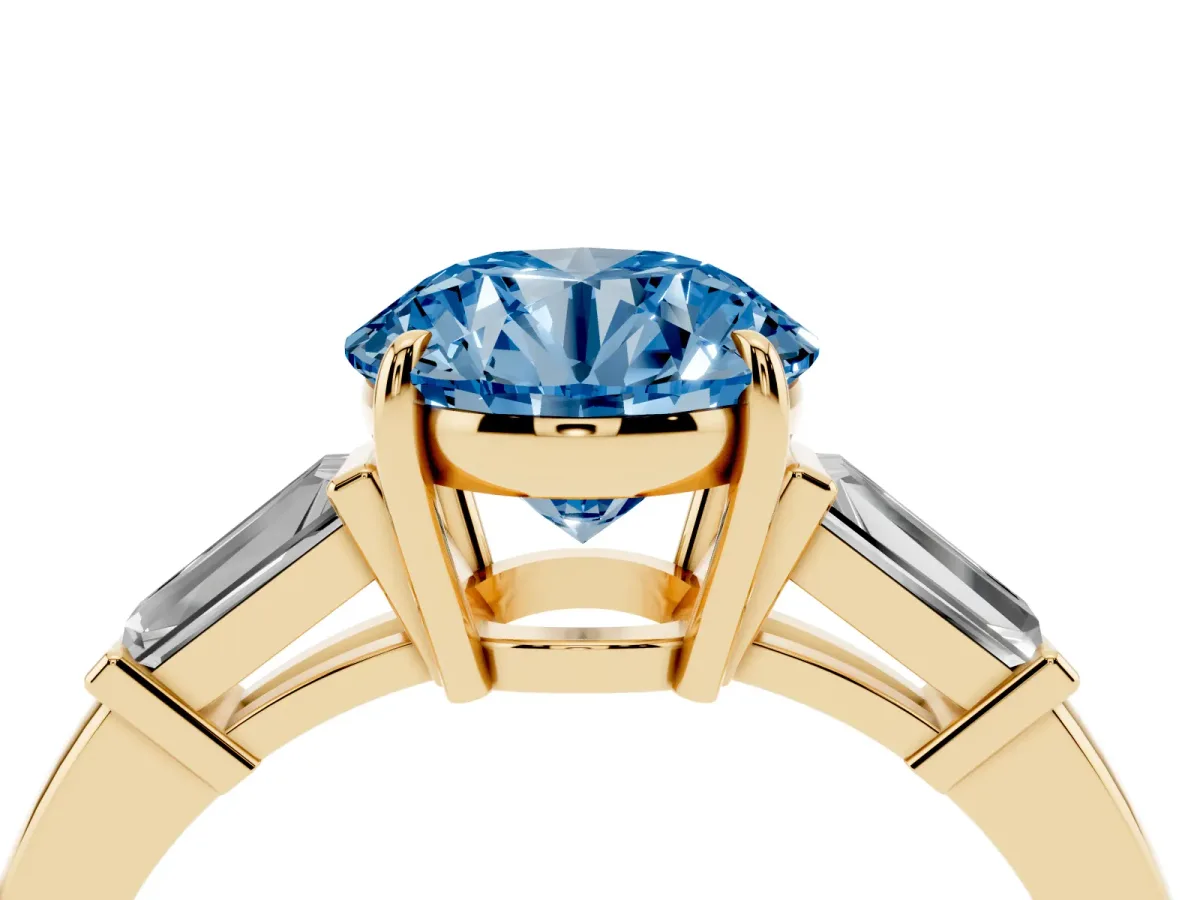 Fancy Blue Round Cut Diamond Three-Stone Ring with Tapered Baguette Side Stones and Prong Setting Yellow gold