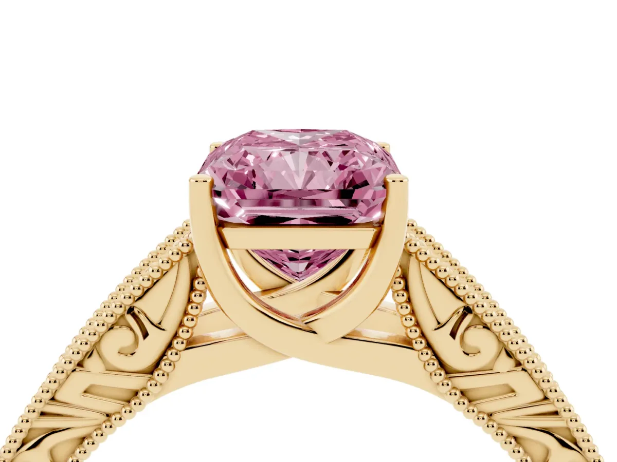 Fancy Pink Radiant Cut Diamond Solitaire Ring with Engraved Band and Four-Prong Setting Yellow gold