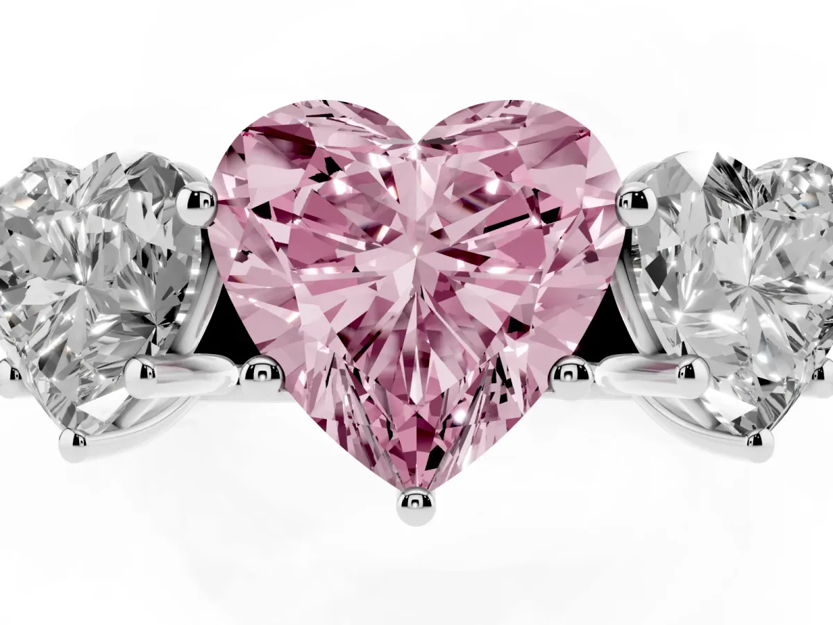 Fancy Pink Heart Cut Three-Stone Diamond Ring with Prong Setting on a Classic Band Silver