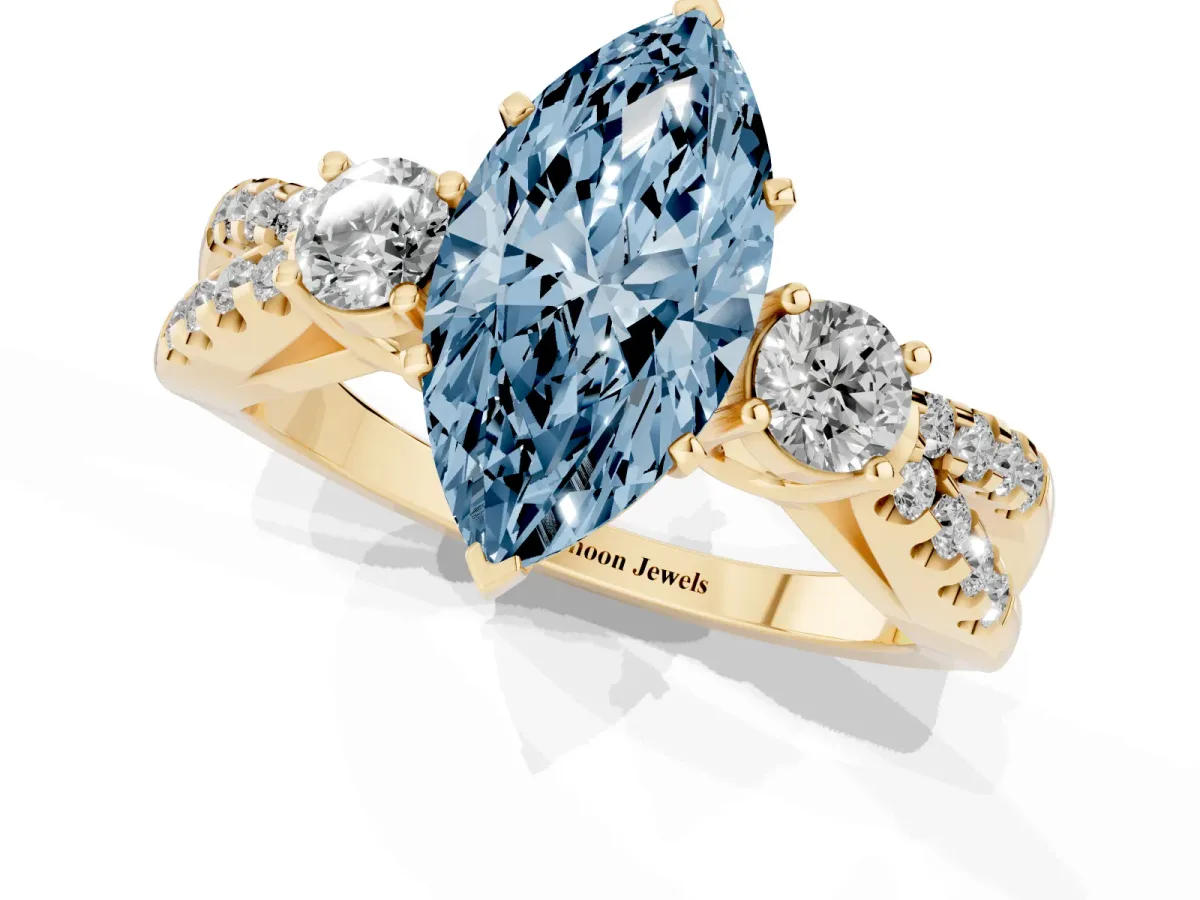 Fancy Blue Marquise Cut Diamond Three-Stone Ring with Pavé Split Shank and Four-Prong Setting Yellow gold