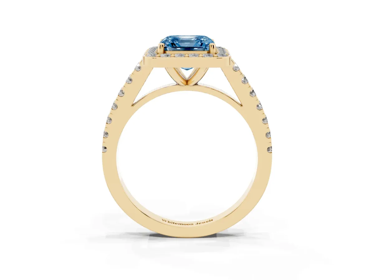 Fancy Blue Asscher Cut Diamond Halo Ring with Round Pavé Split Shank and Prong Setting Yellow gold