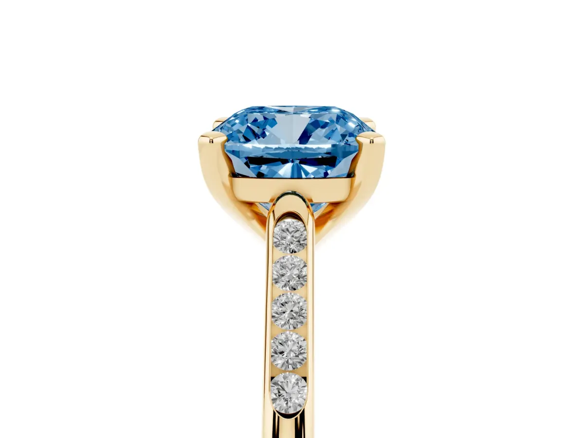 Fancy Blue Cushion Cut Diamond Solitaire Ring with Channel Set Round Band and Prong Setting Yellow gold