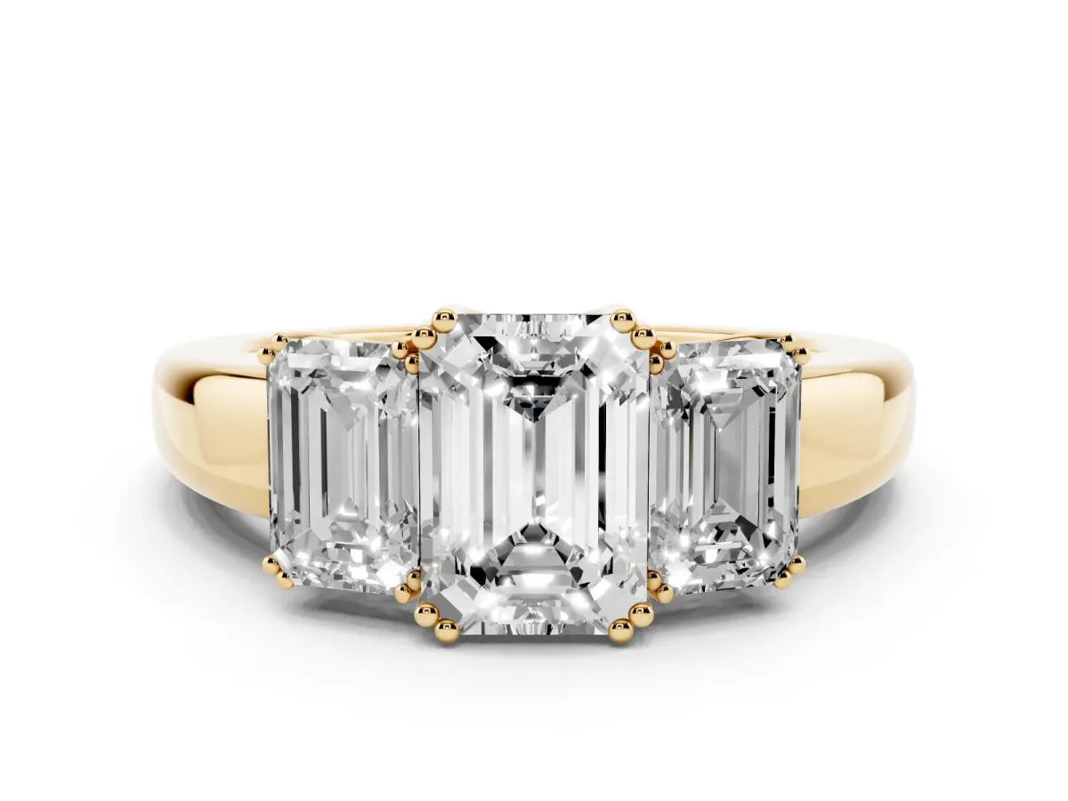Three-Stone Emerald Cut Cut Diamond Ring with Channel Set Band and Four-Prong Setting Yellow gold