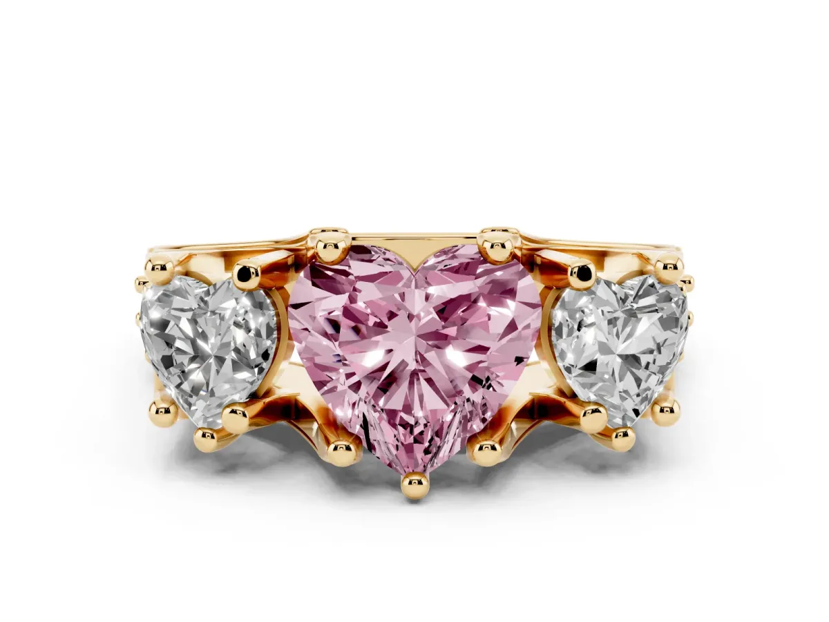 Fancy Pink Heart Cut Diamond Three-Stone Ring with Channel Set Band and Four-Prong Setting Yellow gold