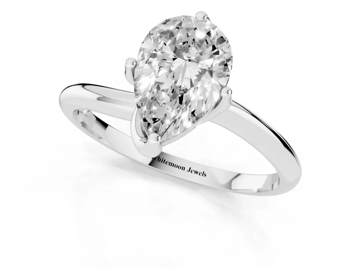 Pear Cut Diamond Solitaire Engagement Ring with Four-Prong Setting and Classic Band Silver