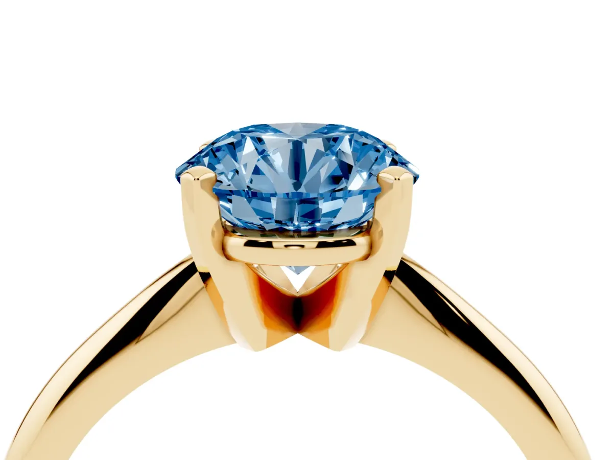 Fancy Blue Round Cut Cut Solitaire Ring with Four-Prong Setting on a Classic Band Yellow gold