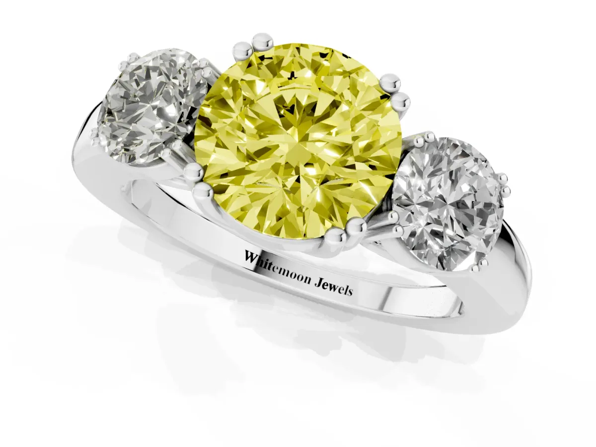 Fancy Yellow Three-Stone Round Cut Cut Diamond Ring with Channel Set Band and Four-Prong Setting Platinum