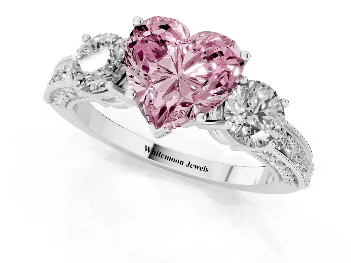 Fancy Pink Heart Cut Three-Stone Diamond Ring with Pavé Band and Four-Prong Setting Silver