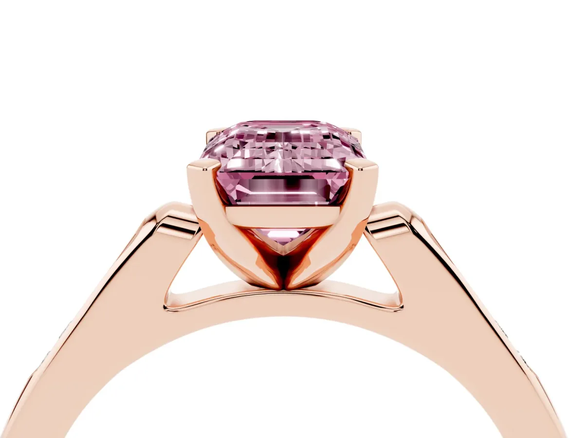 Fancy Pink Emerald Cut Diamond Solitaire Ring with Channel Set Round Band and Prong Setting Rose gold