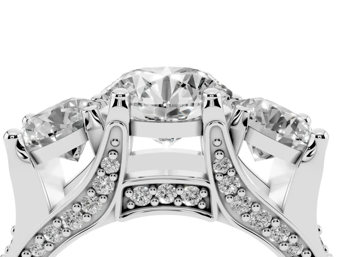 Round Cut Diamond Three-Stone Ring with Channel Set Band and Four-Prong Setting Silver