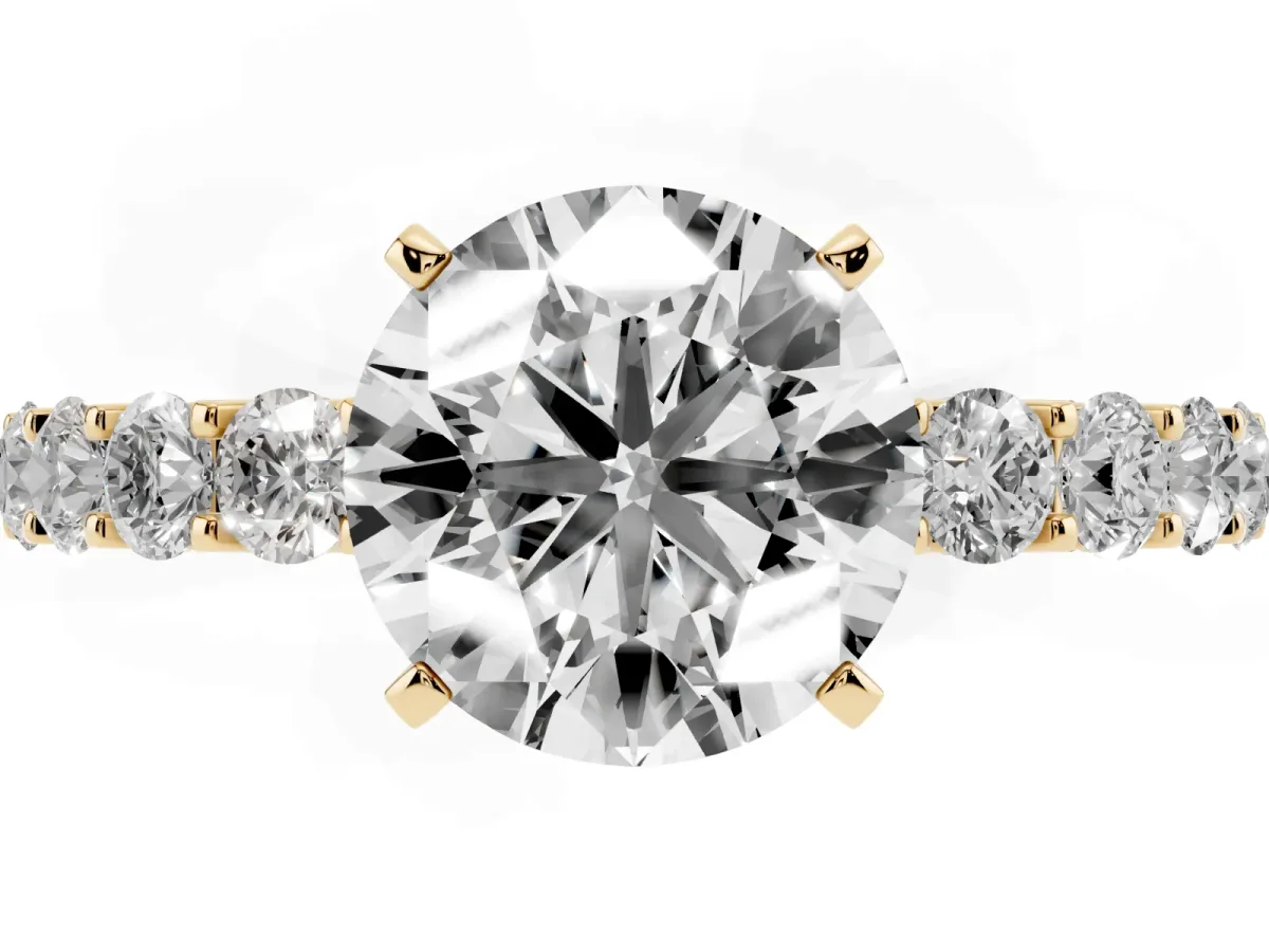 Round Cut Diamond Solitaire Ring with Shared Prong Pavé Band and Four-Prong Setting Yellow gold