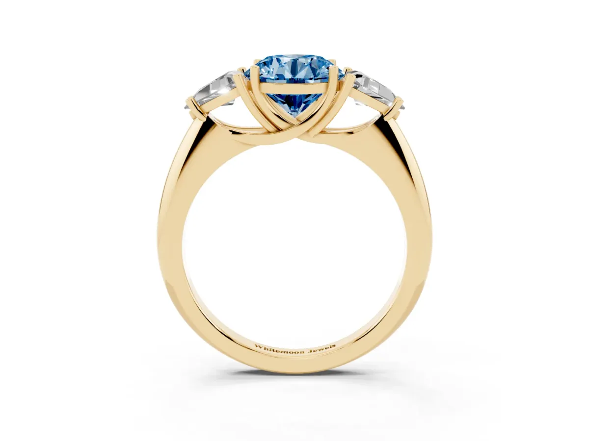 Fancy Blue Three-Stone Round Cut Diamond Engagement Ring with Trillion Side Stones and Prong Setting Yellow gold