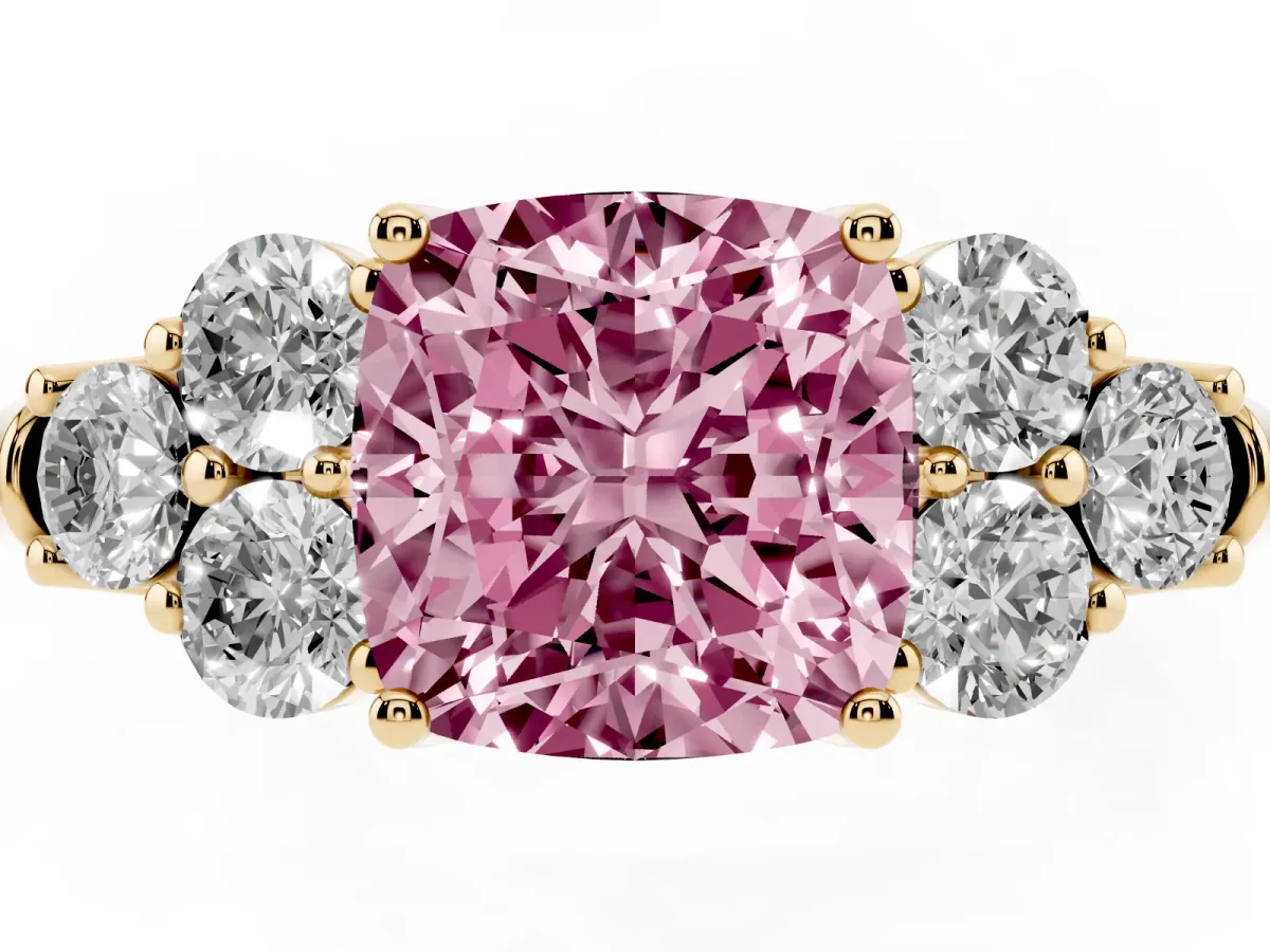 Fancy Pink Cushion Cut Cut Diamond Cluster Ring with Round Accent Stones and Prong Setting on a Classic Band Yellow gold