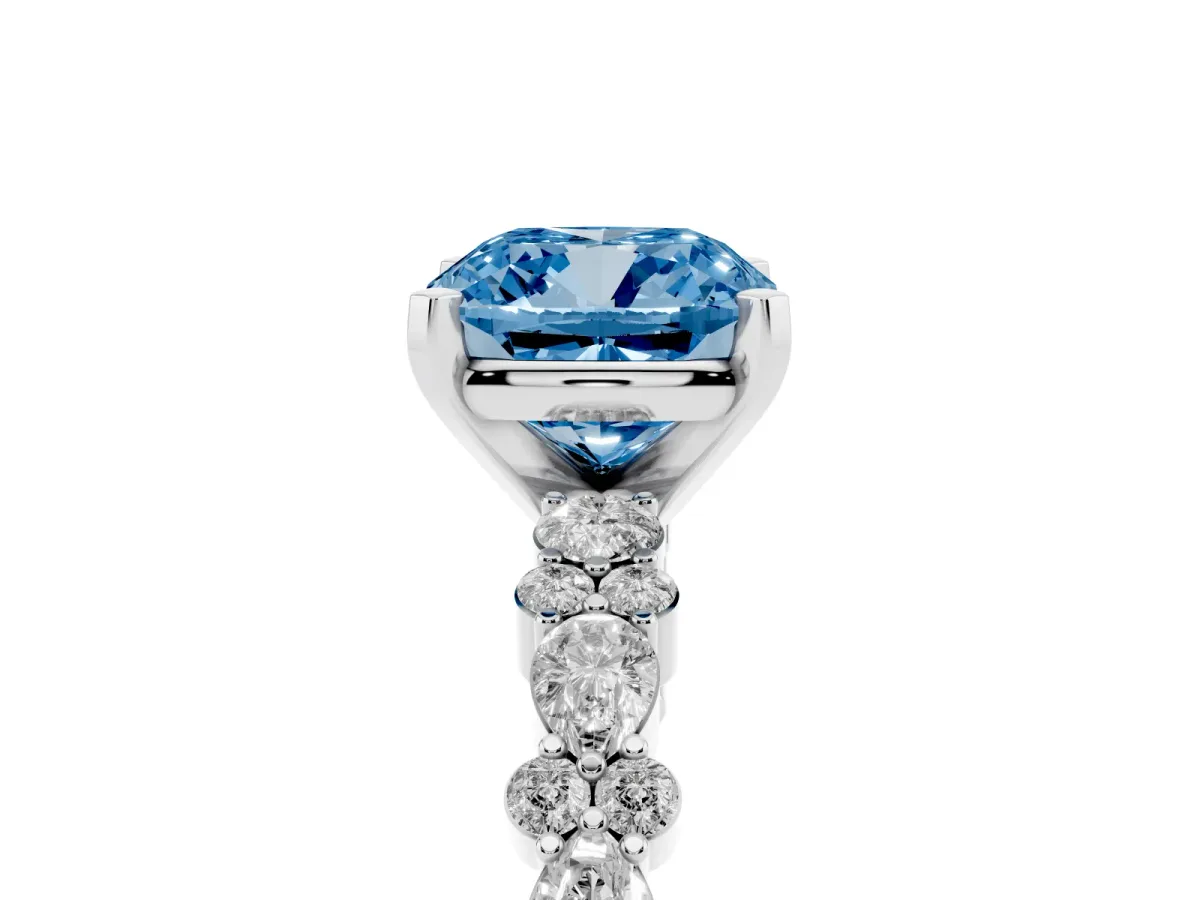 Fancy Blue Cushion Cut Diamond Side Stone Solitaire Ring with Round and Four-Prong Setting Platinum