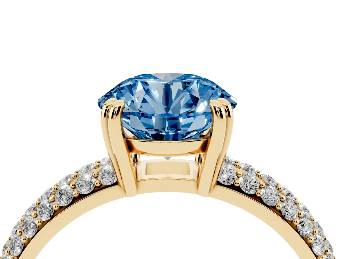 Fancy Blue Round Cut Diamond Solitaire Ring with Multi-Row Round Pavé Band and Prong Setting Yellow gold