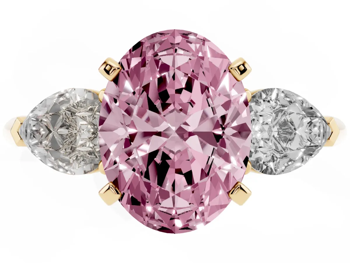 Fancy Pink Three-Stone Oval Cut Diamond Ring with Pear Side Stones and Four-Prong Setting Yellow gold