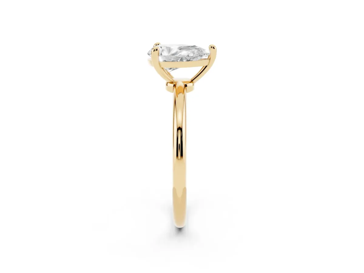 Pear Cut Solitaire Diamond Ring with 4-Prong Setting on a Classic Band Yellow gold
