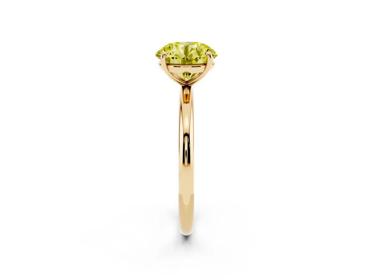 Fancy Yellow Round Cut Solitaire Diamond Ring with Four-Prong Setting on a Plain Band Yellow gold