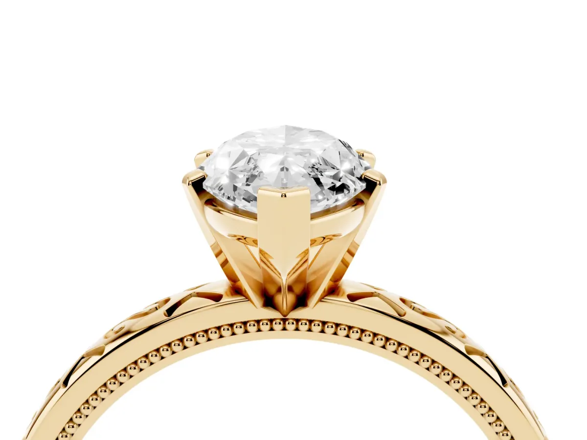 Marquise Cut Solitaire Engagement Ring with Scrollwork Band and Four-Prong Setting Yellow gold