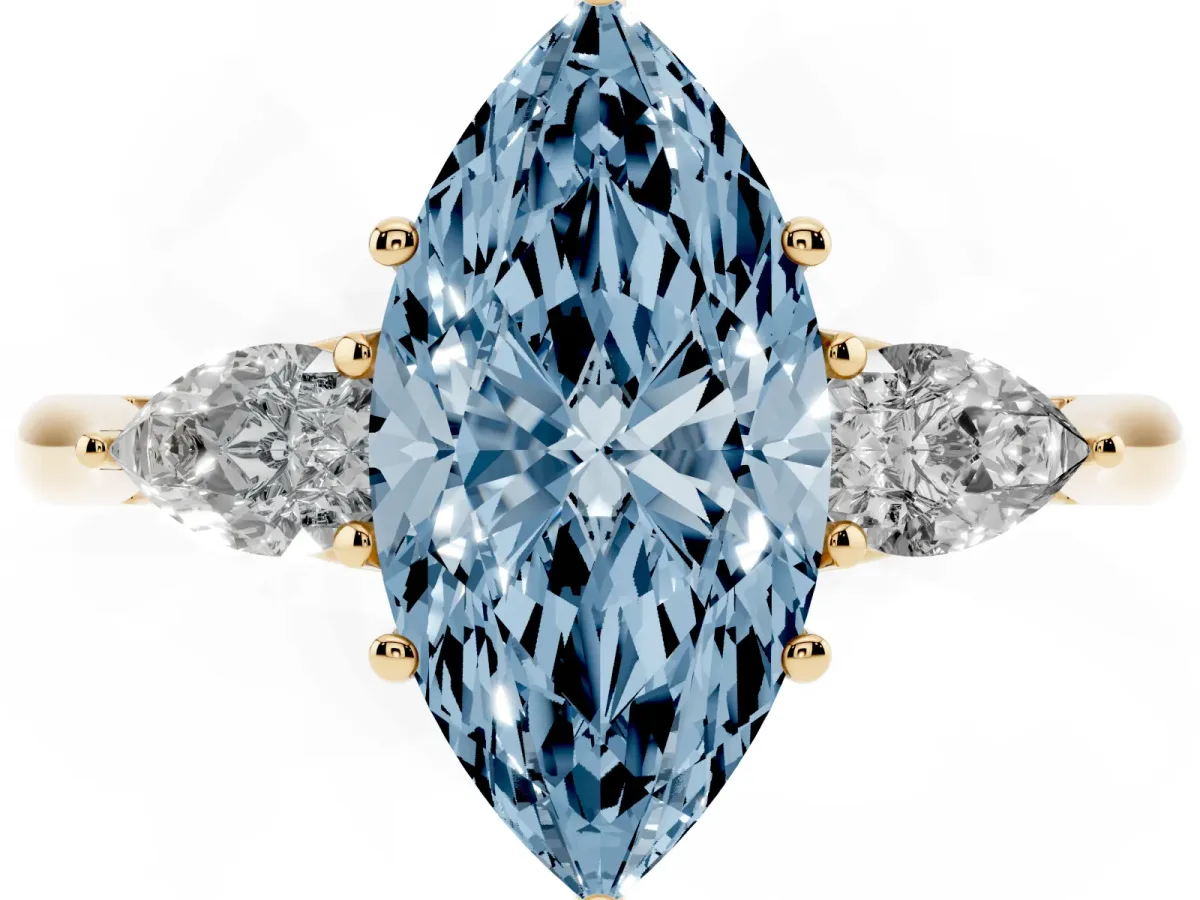 Fancy Blue Three-Stone Marquise Cut Diamond Ring with Pear Side Stones in Four-Prong Setting Yellow gold