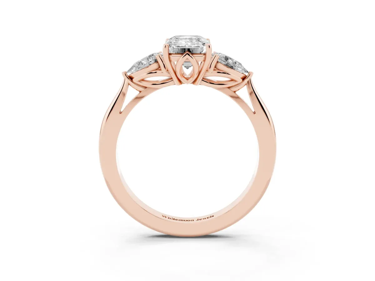 Three-Stone Emerald Cut Diamond Ring with Pear Side Stones in Four-Prong Setting Rose gold