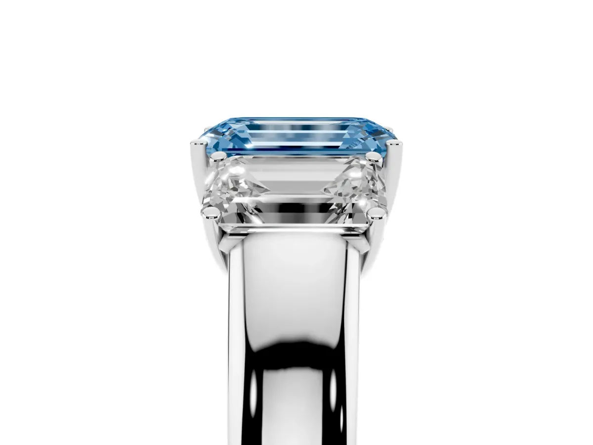 Fancy Blue Three-Stone Emerald Cut Cut Diamond Ring with Prong Setting and Classic Band Silver