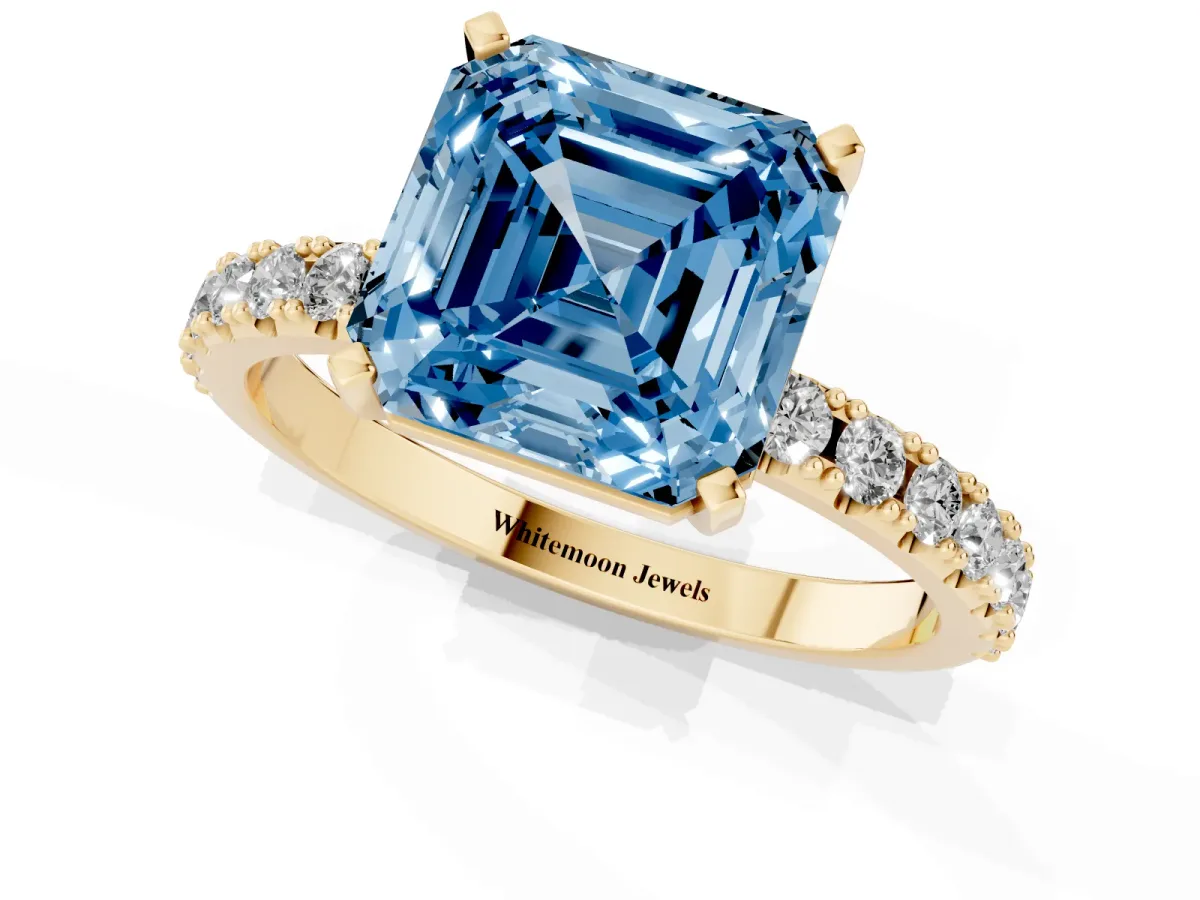 Fancy Blue Asscher Cut Diamond Solitaire Pavé Band with Four-Prong Setting Yellow gold