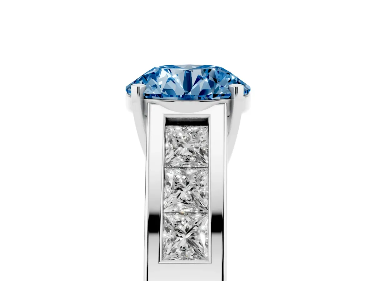 Fancy Blue Round Cut Cut Channel Set Solitaire Ring with Four-Prong Setting Silver