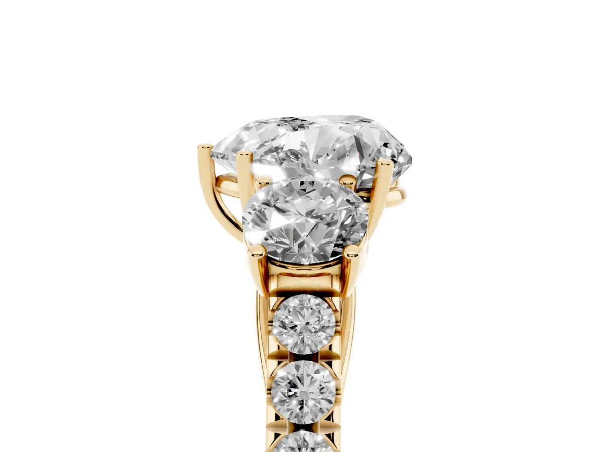 Heart Cut Cut Diamond Three-Stone Ring with Round Side Stones and Pavé Band Yellow gold