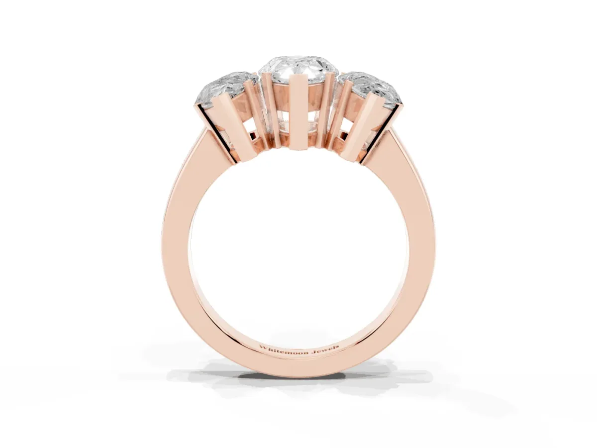 Three-Stone Pear Cut Cut Diamond Ring with Channel Set Band and Four-Prong Setting Rose gold