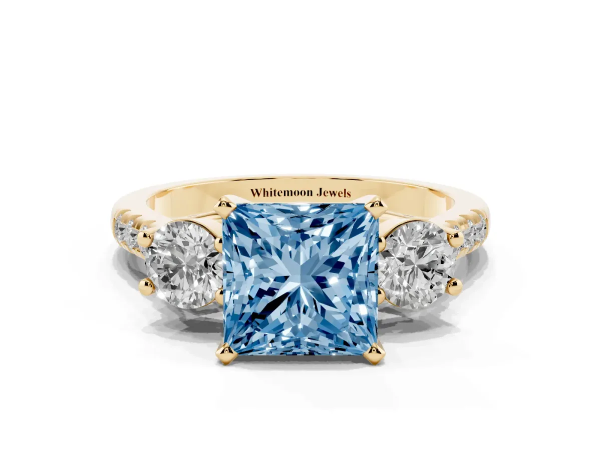 Fancy Blue Three-Stone Princess Cut Diamond Pavé Band with Four-Prong Setting Yellow gold
