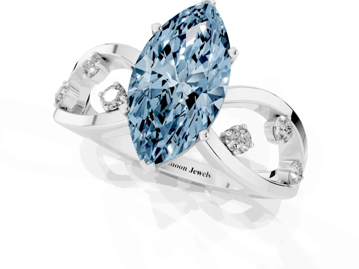 Fancy Blue Marquise Cut Cut Solitaire Diamond with Side Stones on Criss-Cross Band and Four-Prong Setting Silver