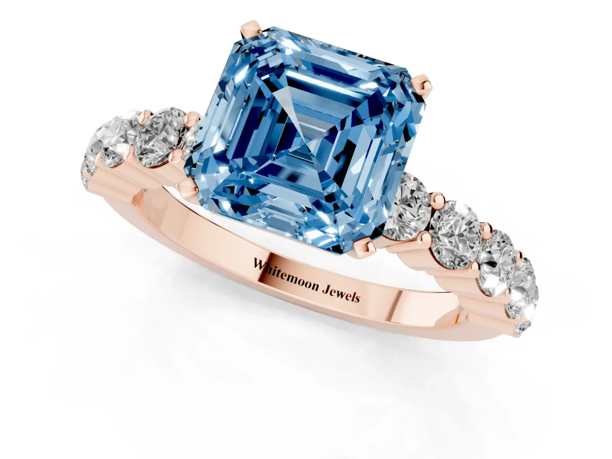 Fancy Blue Asscher Cut Diamond Solitaire Ring with Shared Prong Round Side Stones Rose gold