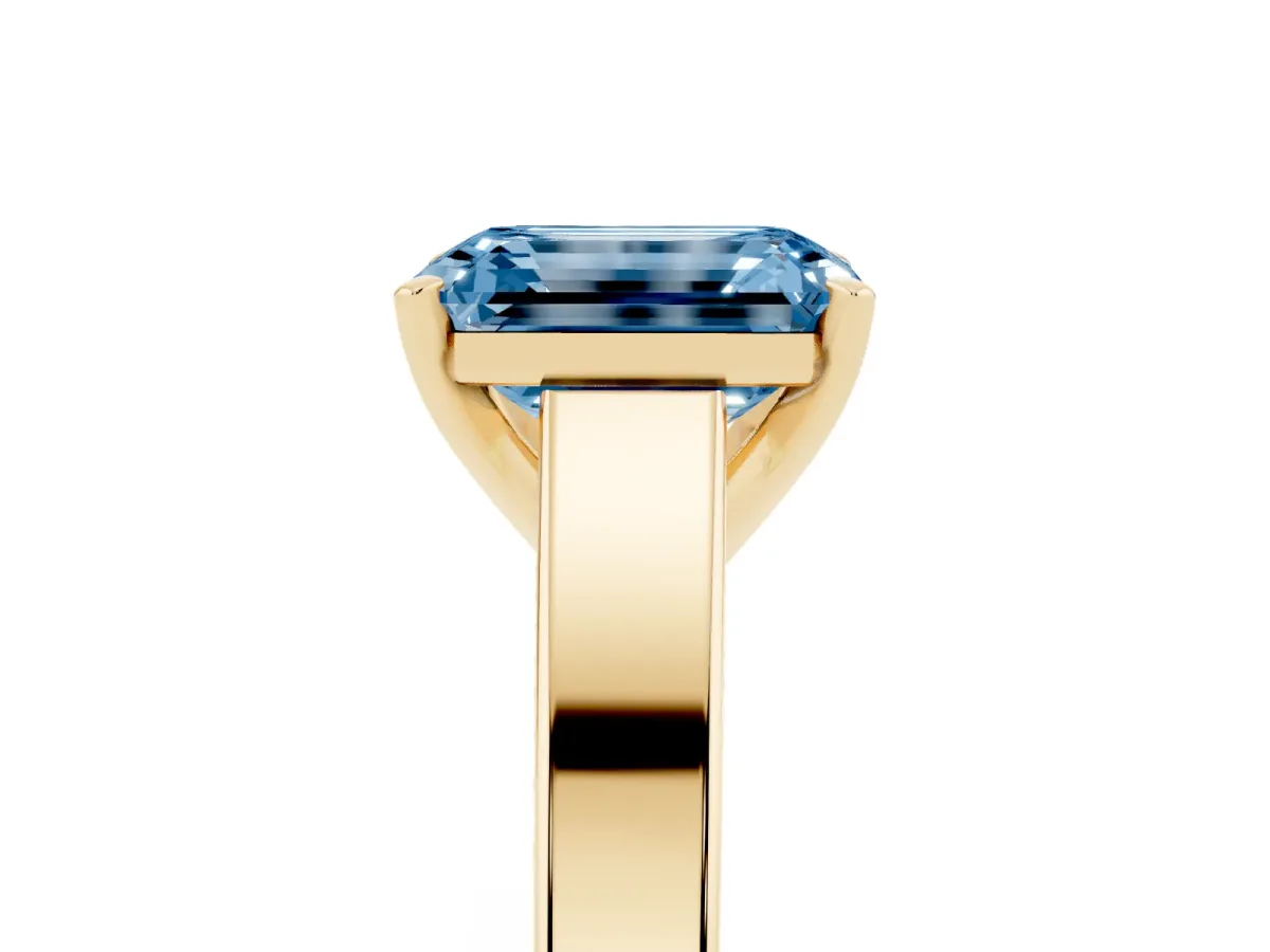 Fancy Blue Emerald Cut Solitaire Engagement Ring with Four-Prong Setting and Tapered Band Yellow gold