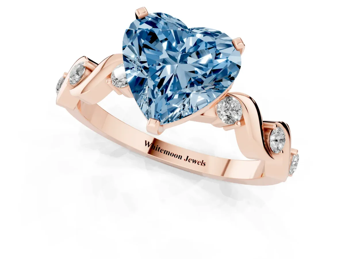 Fancy Blue Heart Cut Diamond Solitaire Twisted Band with Round Accents and Prong Setting Rose gold