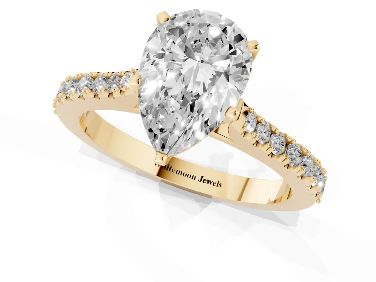 Pear Cut Cut Solitaire Diamond Engagement Ring with Pave Band and Four-Prong Setting Yellow gold