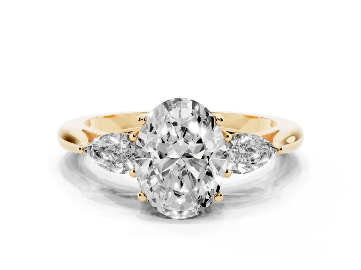 Oval Cut Diamond Three-Stone Ring with Pear Side Stones and Prong Setting Yellow gold