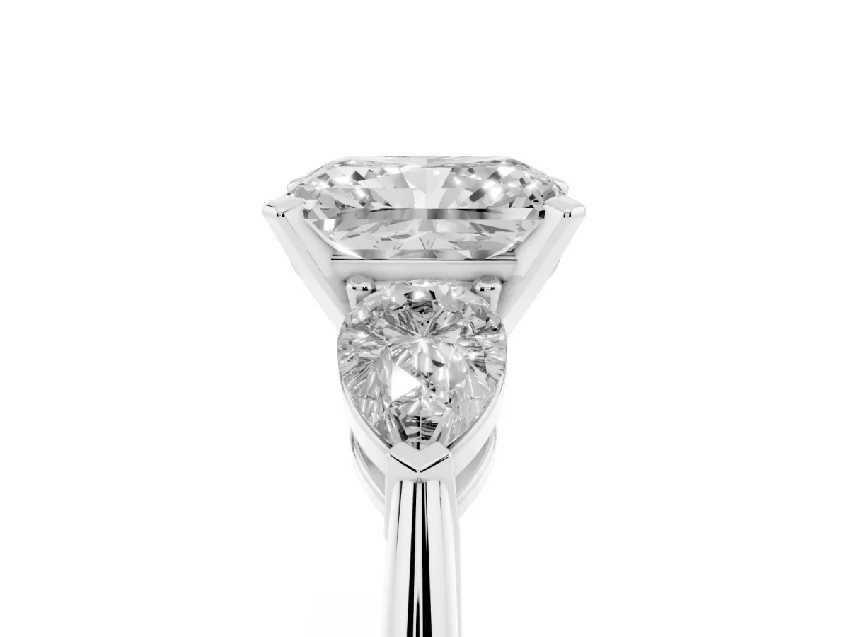 Three-Stone Radiant Cut Diamond Ring with Pear Side Stones and Four-Prong Setting Platinum