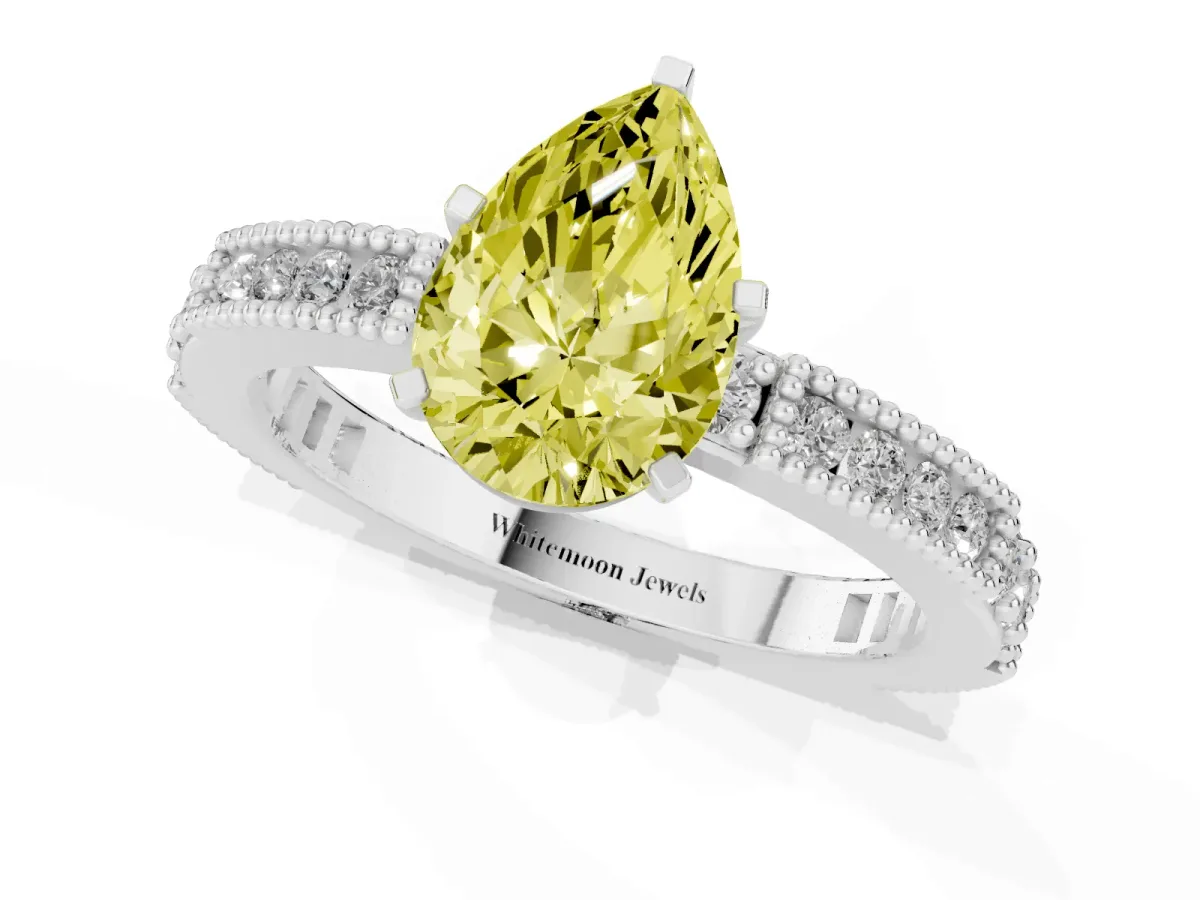Fancy Yellow Pear Cut Solitaire with Pavé Band and Four-Prong Setting Platinum