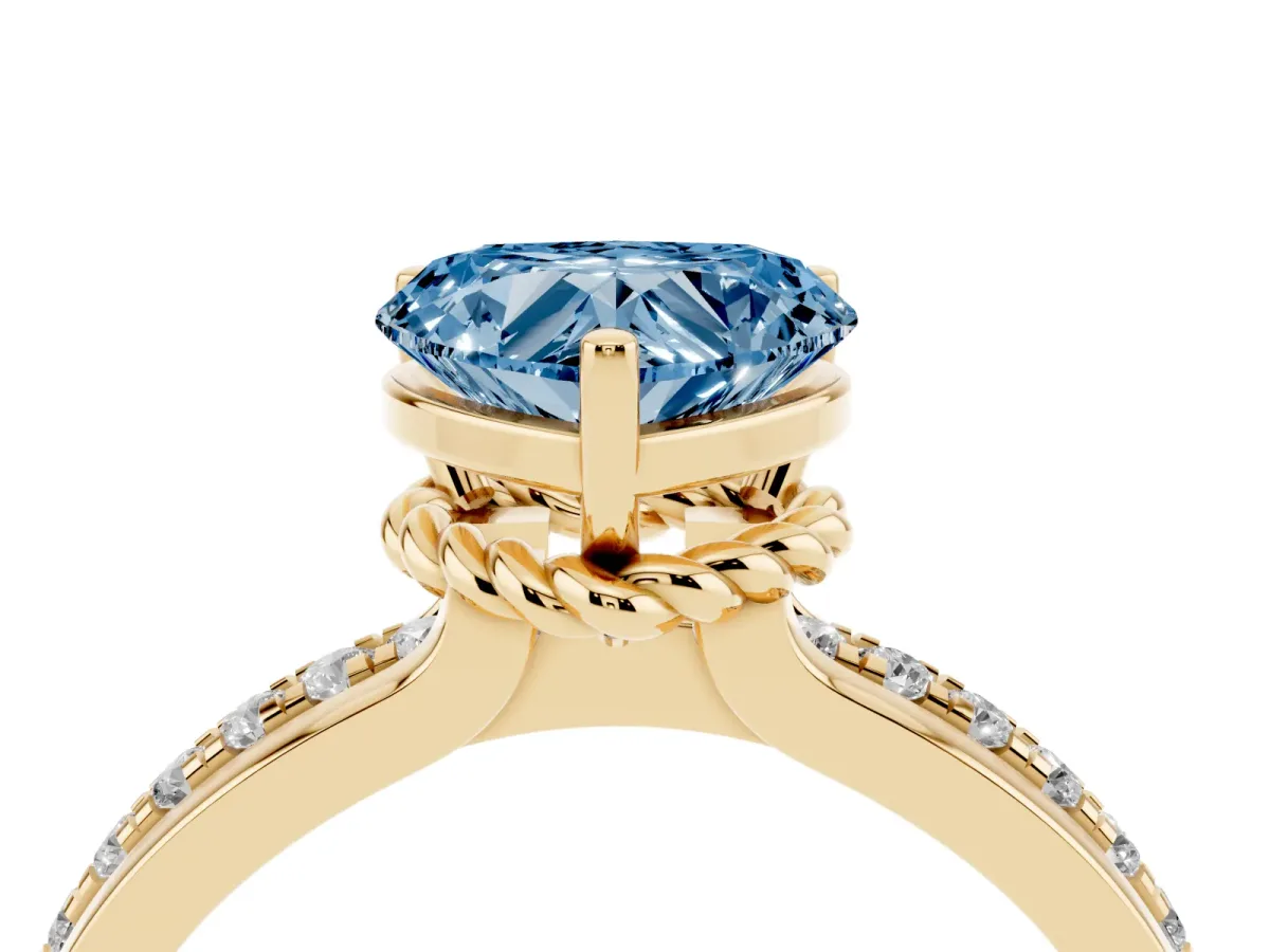 Fancy Blue Heart Cut Solitaire Diamond Ring with Channel Set Band and Six-Prong Setting Yellow gold