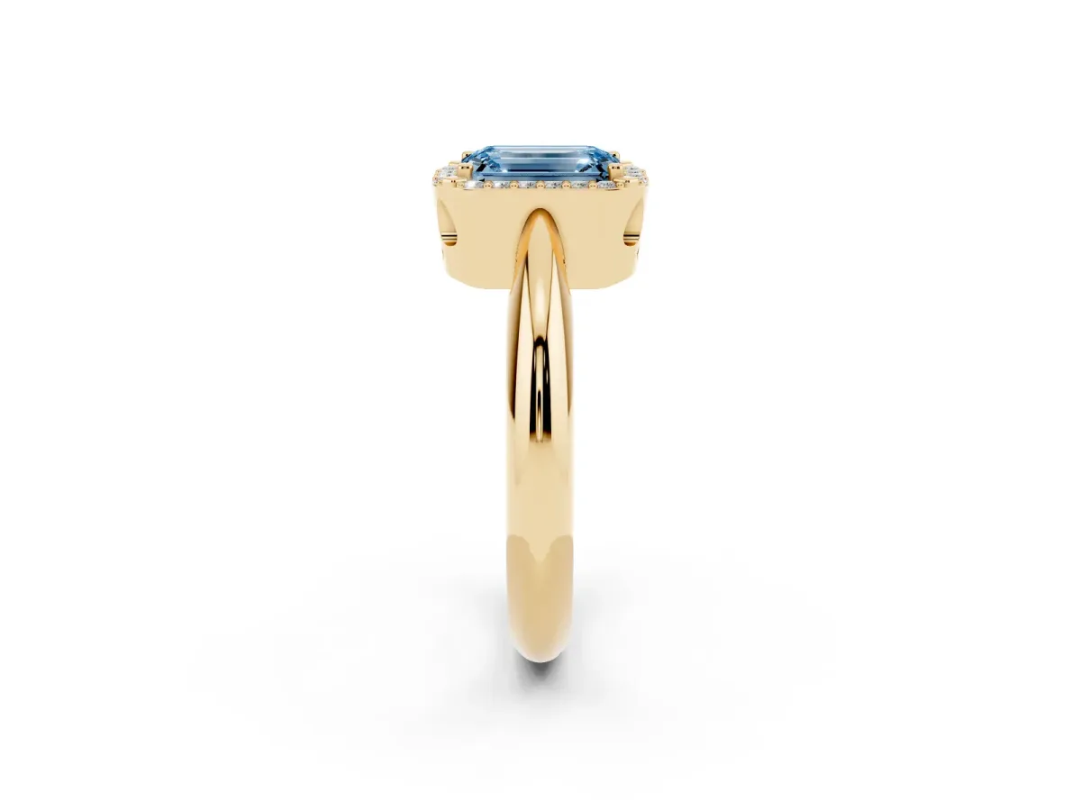 Fancy Blue Emerald Cut Cut Diamond Halo Engagement Ring with Split Shank and Four-Prong Setting Yellow gold
