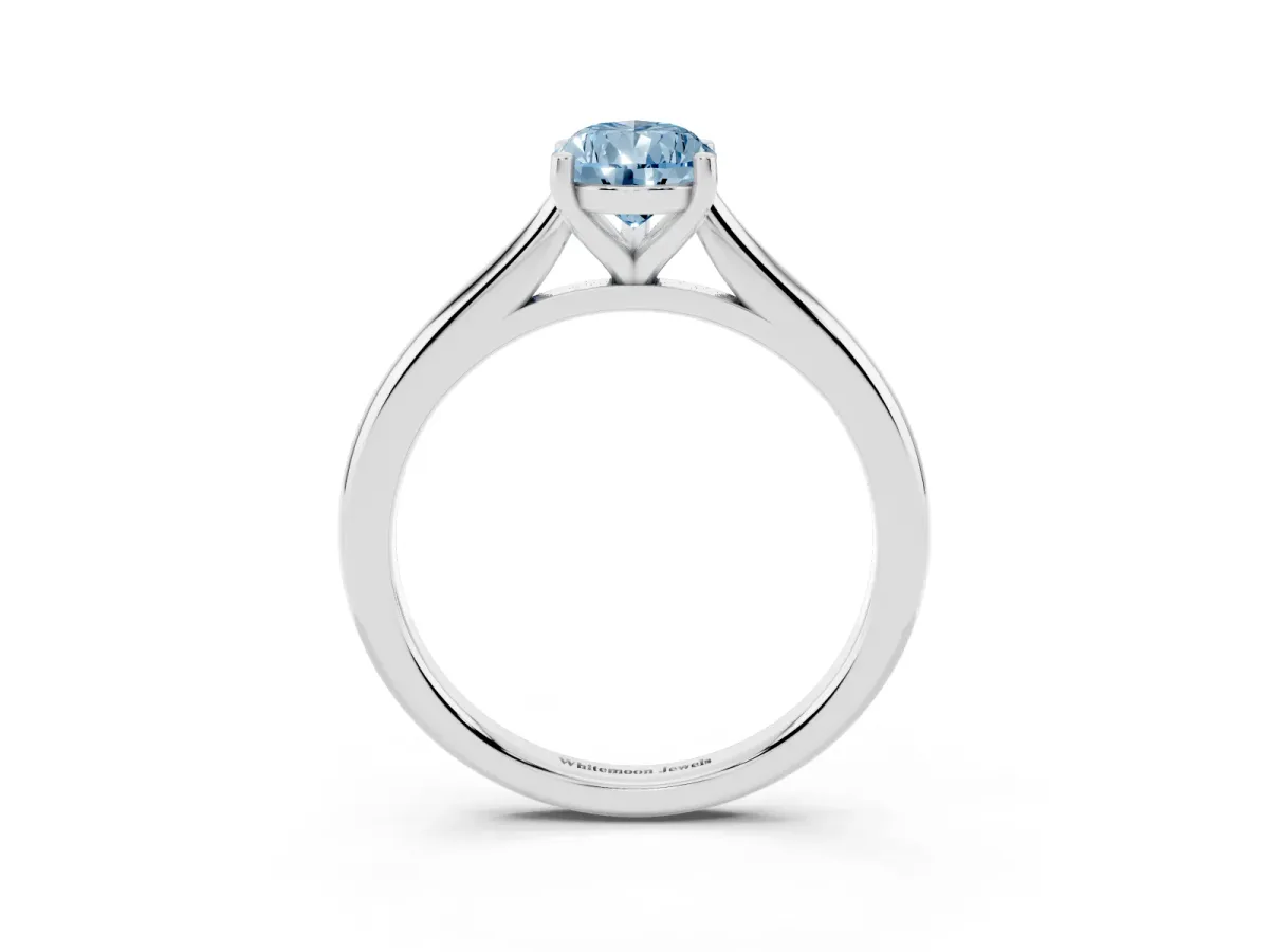 Fancy Blue Pear Cut Cut Solitaire Ring with Cathedral Band and Four-Prong Setting Silver