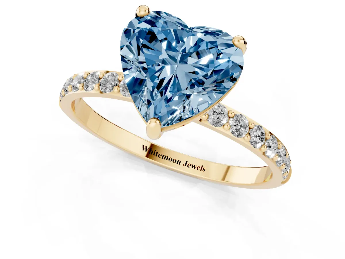 Fancy Blue Heart Cut Diamond Solitaire Ring with Round Pavé Band and Prong Setting Yellow gold